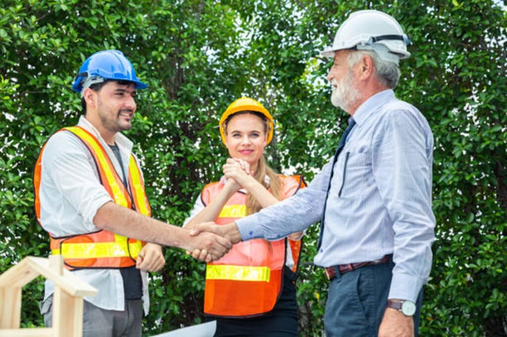 Tree trimming and pruning service in Akron with a professional crew carefully cutting tree branches near a residential property.